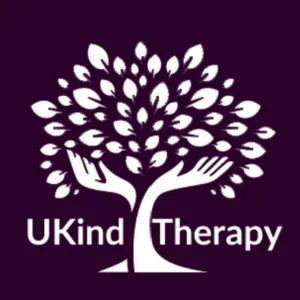 The UKind Therapy logo looks like a tree. The trunk looks like hands holding up the leaves.